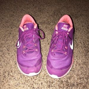 Pink and purple Nike Women’s tennis shoes